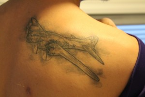 "There is a story to my tattoo - the meaning behind it is very symbolic in many of ways. My tattoo is a B-17 bomber plane which my Great Grandfather flew during WWII. The picture is actually the one he flew, his numbers are on the plane and everything. He was one of the biggest father figures I ever had. So, I got it in his honor of serving our country and being there for me."