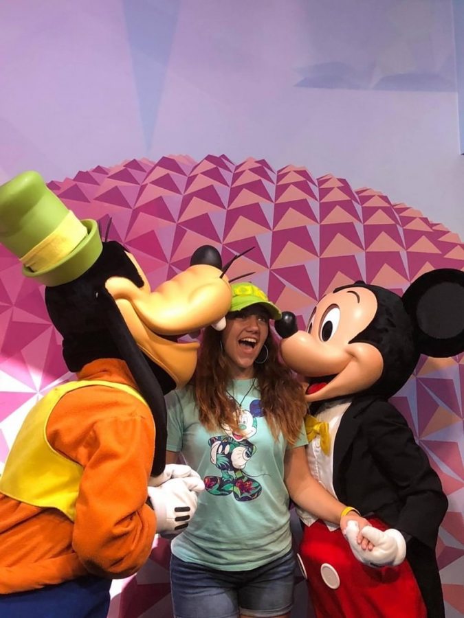 Katie Ulicine poses with two of her favorite Disney characters, Mickey and Goofy.