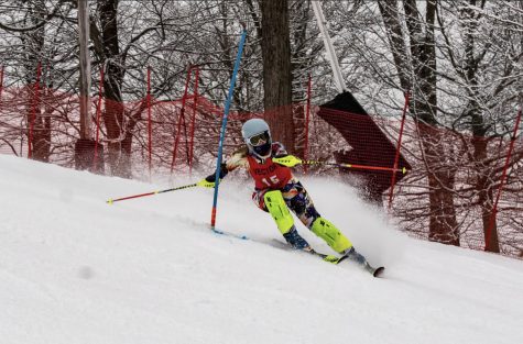Riley Baughman skis down the twists and turns of the slopes pushing for a win. 