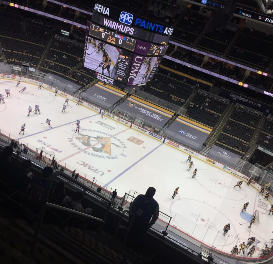 The Pittsburgh Penguins and New York Rangers warming up before the game.