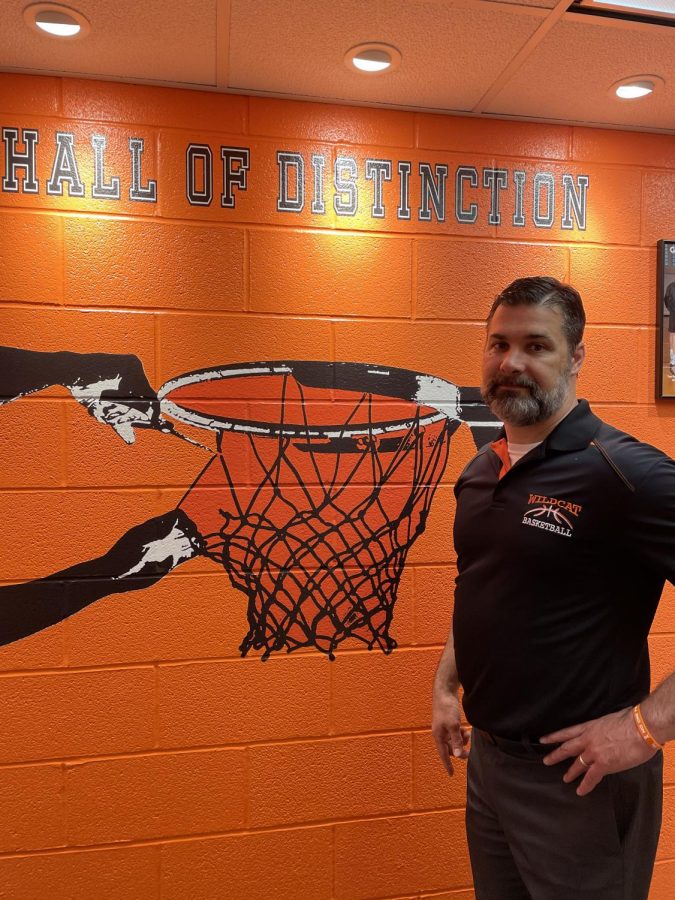 Mr. Wetzel stands in the Hall of Distinction, hoping to put up another picture this year. 
