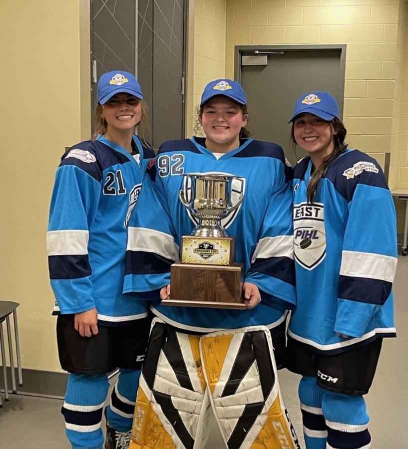 Corinne+Brunetto+celebrates+with+teammates+Olyvia+Yackmack+and+Kylie+MaKenzie+after+their+2-1+overtime+win+in+the+PIHL+Girls+Championship.+In+early+summer+2022%2C+they+played+at+UPMC+Lemieux+Sports+Complex.+The+girls+played+a+hard+and+challenging+season%2C+but+came+out+with+a+win+in+the+end.+
