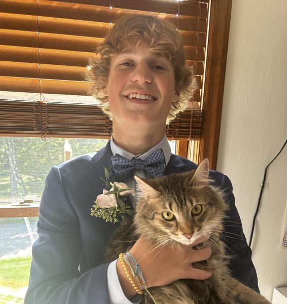 Day of Hoomecoming 23, a day after the crash. Zyan appears to be okay, but he had a concussion. A picture with his cat, Luca. 