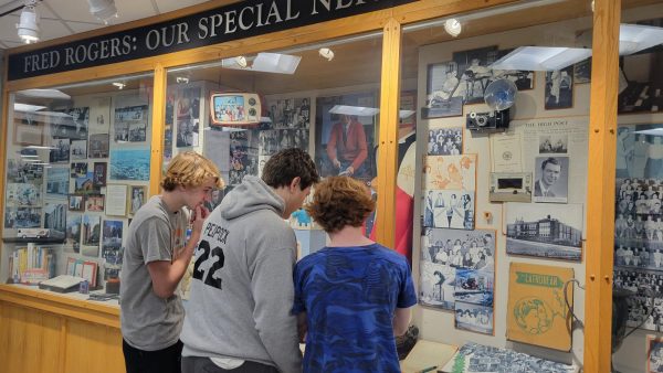 Students look at the legacy of Mr Rogers who thought highly of the art collection. 