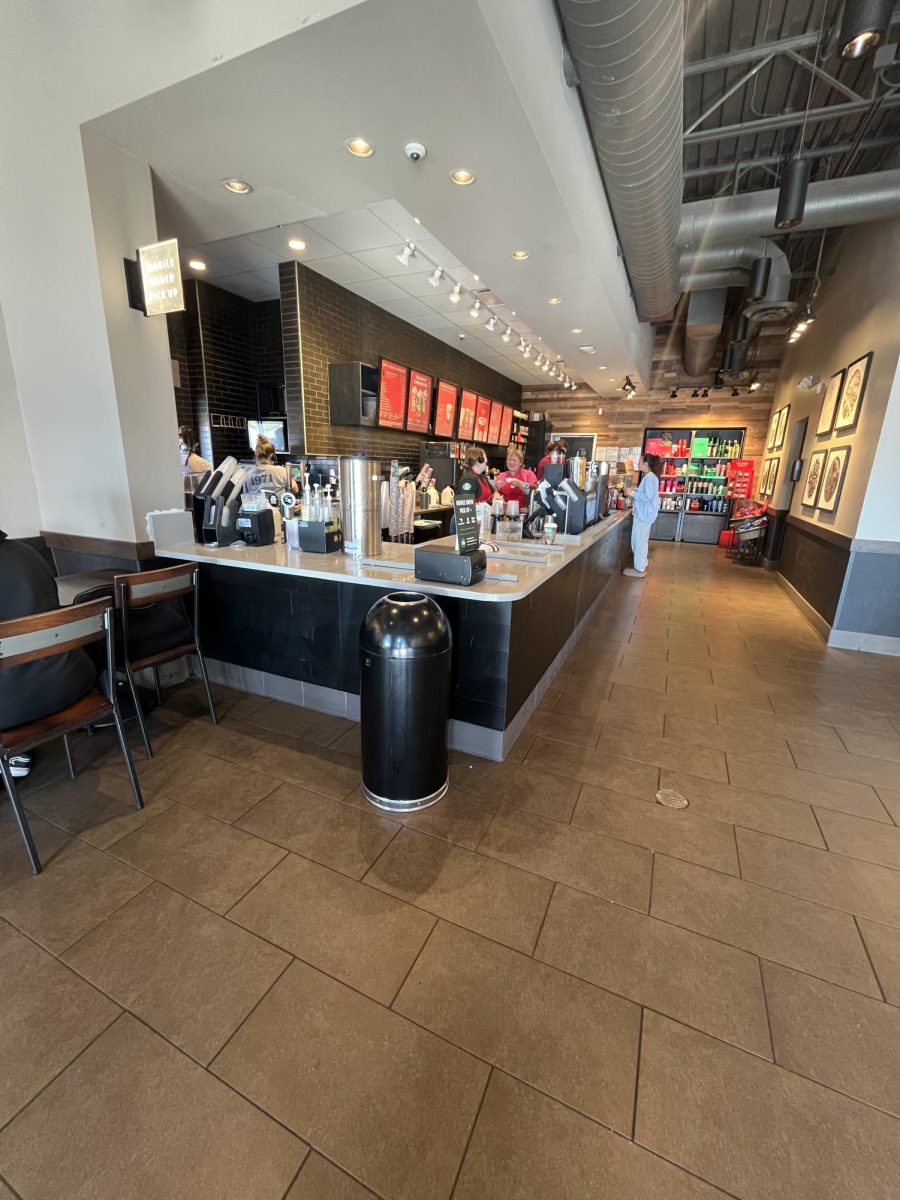 Starbucks workers flying through orders during rush hour.