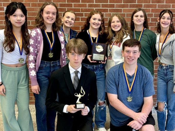 Photo #1: Henry Bradley and Kaden Shannon are pictured in the first row (left to right), along with Julia Zhu, Kate Larson, Sadie Bridge, Ciara Eachus, Alexa Yurko, Skylar Brennan, and Mimi Fridg in the second row