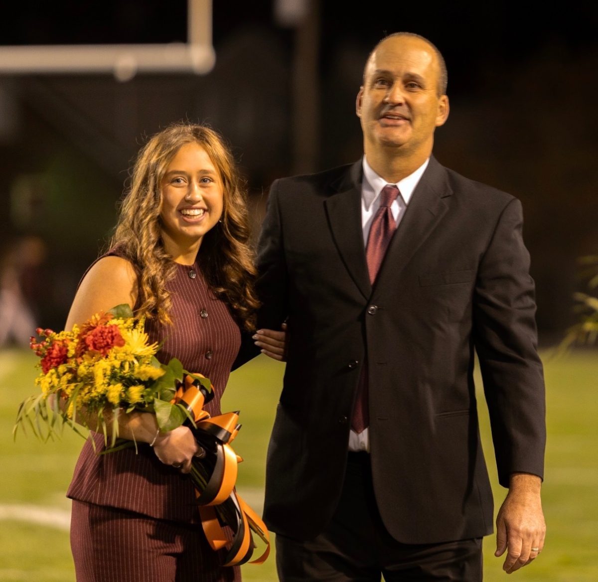 Sara Blossey and her father, Jeremy Blossey, are pictured after Sara was crowned Homecoming Queen.