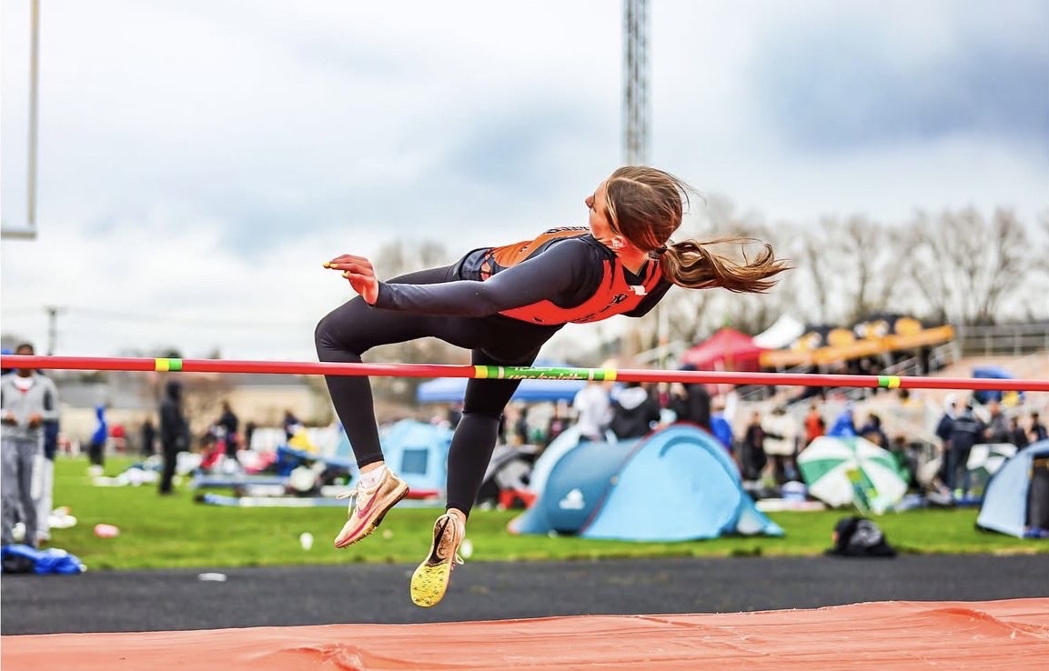 Ella Noel making it over the pole while high jumping at a meet last season